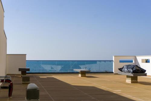 a deck of a boat with a view of the water at Hotel Morfeus in Durrës