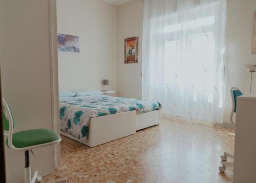 a bedroom with a bed and a mirror at La casa di Grazia in Rome