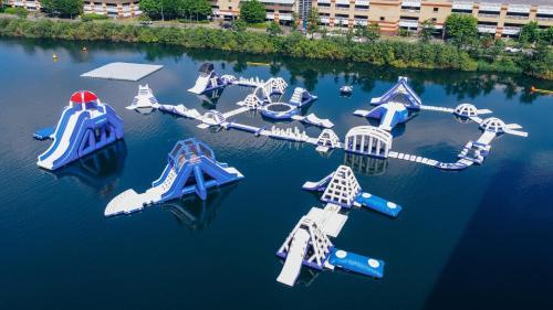 an aerial view of a group of water slides in the water at Luxury New Flat, 5mins from Lakeside Mall in West Thurrock