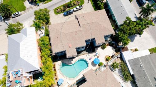 an overhead view of a house with a swimming pool at Coastal Cheer in Bradenton Beach