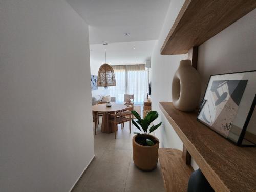 a living room with a table and a dining room at Aria Ocean mountain 715B QueridaEstancia in Bucerías
