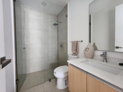 a bathroom with a toilet and a sink and a shower at Aria Ocean mountain 715B QueridaEstancia in Bucerías