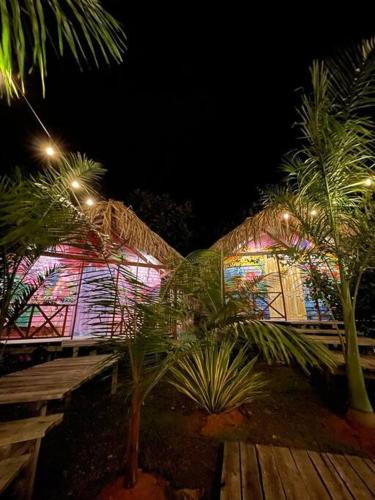 a building with a stained glass window with palm trees in front at finca playa seca in Santa Fe de Antioquia