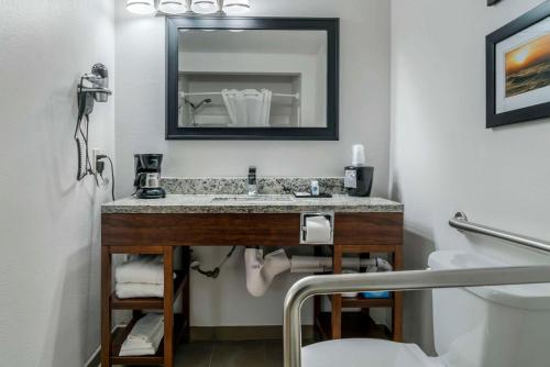 a bathroom with a sink and a mirror at Comfort Inn East Oregon - Toledo in Oregon