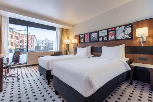 Letto o letti in una camera di Radisson Blu Scandinavia Hotel, Oslo