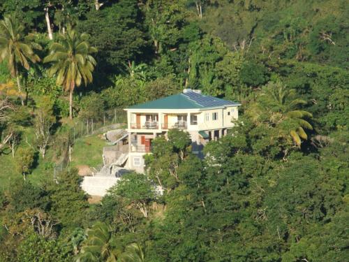 a large house in the middle of a forest at Belle Etoile - Celestial Hideaway in Soufrière
