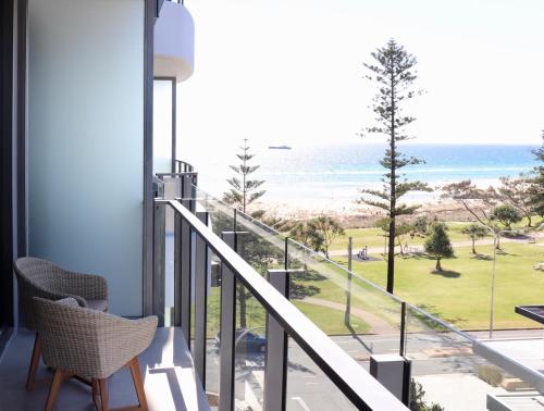 a balcony with a view of the beach at X Kirra Apartments in Gold Coast