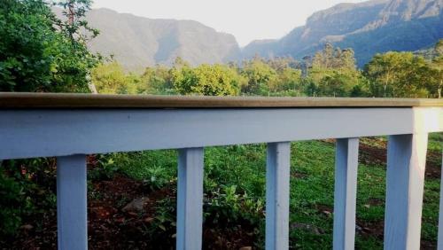 a balcony with a view of the mountains at Tiny House Garden - Aparados da Serra - SC in Praia Grande