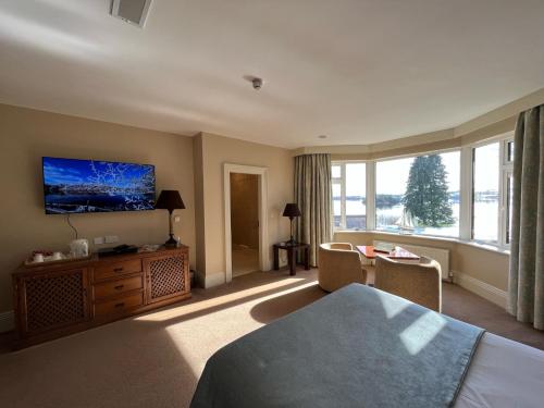 a hotel room with a bed and a large window at St Kyrans Guest House in Virginia