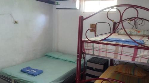 Postel nebo postele na pokoji v ubytování Hostal San Andrés de k-noa