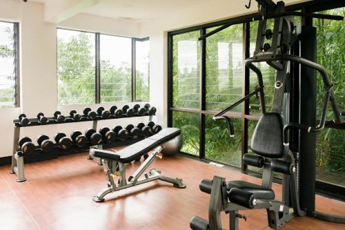 a gym with a bench and a lot of windows at Abagatan ti Manila in Alfonso