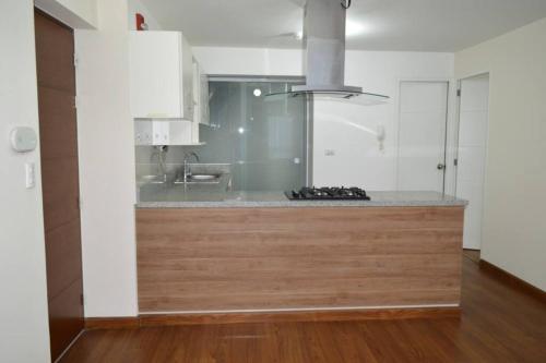 a kitchen with a sink and a counter top at Hermoso departamento en exclusivo Condominio in Arequipa