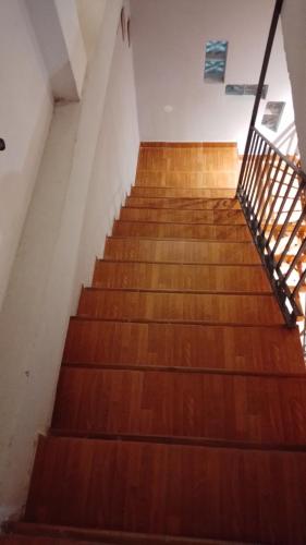 a staircase in an old building with wooden floors at Aires del Cerro in Yerba Buena
