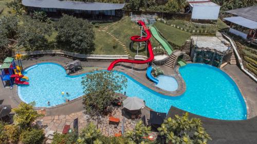 an overhead view of a swimming pool at a resort at Umadhatu Resort by Amerta in Tabanan