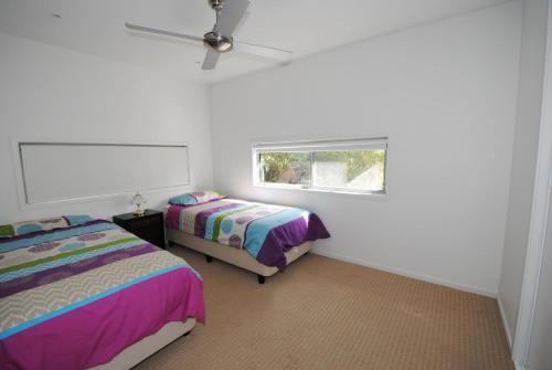 Postel nebo postele na pokoji v ubytování Villa Vincentia - Belle Escapes Jervis Bay