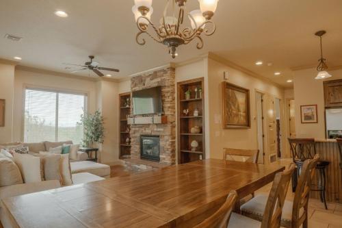 a dining room with a table and a fireplace at H7-Heavenly-Ground Floor 3-bedroom Hillside View in Hurricane