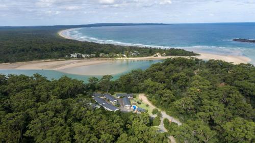 an aerial view of a house and a beach at Haven Holiday Resort Sussex Inlet in Sussex inlet