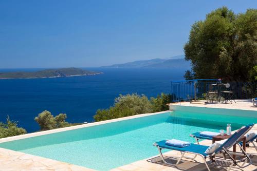 a swimming pool with a view of the ocean at Villa Evalin - Pretty Villa Like at Home for Unforgettable Holidays in Sivota