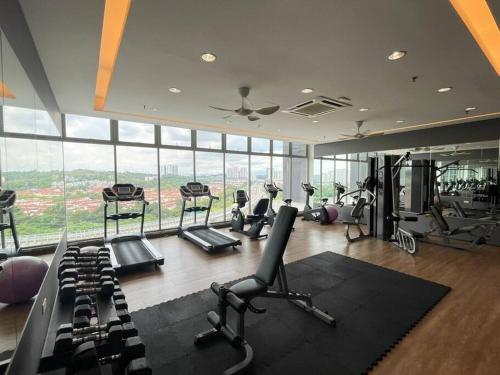 a gym with treadmills and exercise equipment in a building at 3Element*CornerUnit*Goodview* *NSK*Aeon*wifi in Seri Kembangan