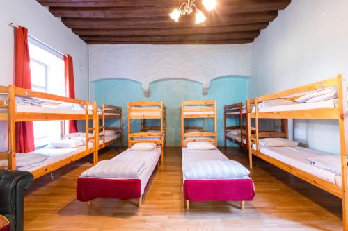 a room with four bunk beds in a hostel at Old Town Hostel Alur in Tallinn