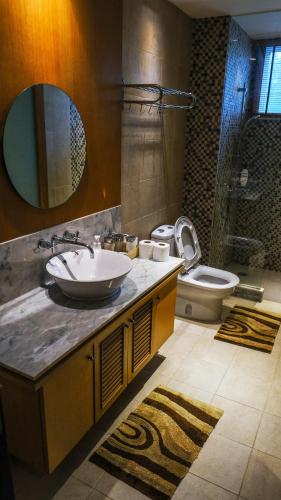 a bathroom with a sink and a toilet at 2BR Pool Accesss at Blue Lagoon - Near Sheraton Hua Hin in Hua Hin