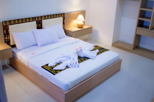 Кровать или кровати в номере Sapak Bungalow