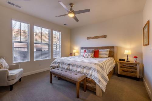 a bedroom with a bed and a chair and windows at The Escondido Gem, Pet Friendly, Pickleball Courts in Washington