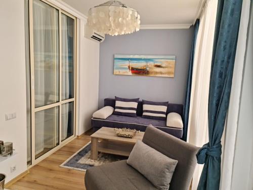 a living room with a couch and a table at GH Apartment Admiral Sveti Vlas in Sveti Vlas