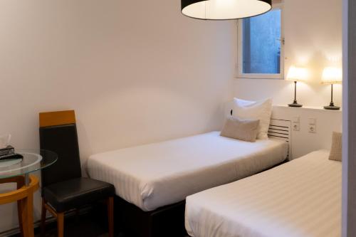 Cama o camas de una habitación en Hotel Plantage