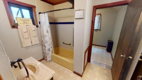 a bathroom with a shower and a sink at Aspen Hollow In The Upper Valley With High Speed Wifi in Red River