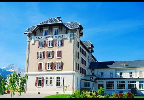 a large building with a sign on top of it at Best Western Grand Hotel de Paris & Spa in Villard-de-Lans
