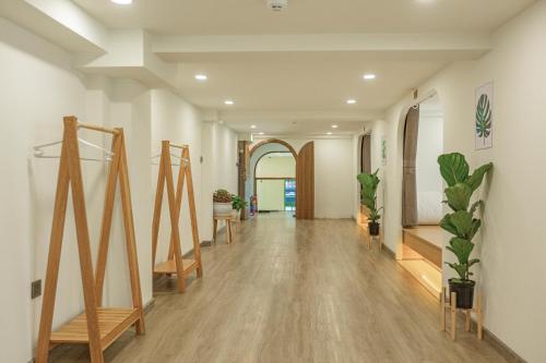 an empty hallway with plants on the walls at Dahill 196 Dalat in Da Lat