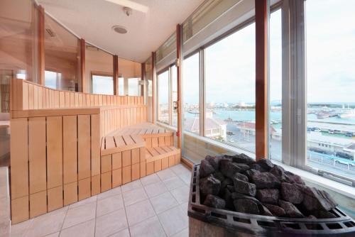 a room with a large room with a large window at THIRD ishigakijima in Ishigaki Island