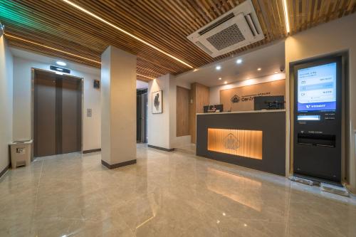 a lobby with a large screen in a building at Hotel Centro Stay in Incheon