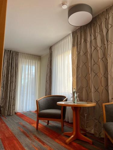 Uma área de estar em Hotel Prinz