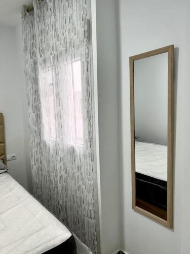 Кровать или кровати в номере RockSide Residences Suites La Línea N1