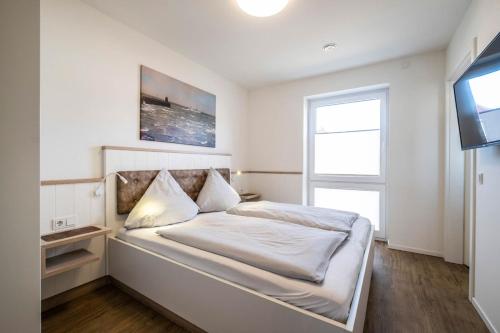 Postel nebo postele na pokoji v ubytování Haus Strandläufer Apartment 1 6 DeichLounge