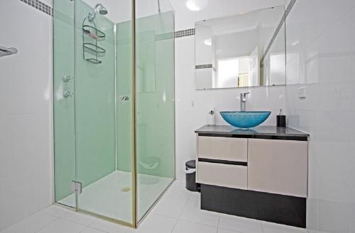 a bathroom with a glass shower and a sink at Turquoise Escape in Jurien Bay