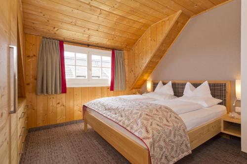 A bed or beds in a room at Mountain Resort Feuerberg