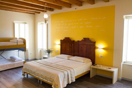 Postel nebo postele na pokoji v ubytování Villa di Cazzano - BioLuxury Living