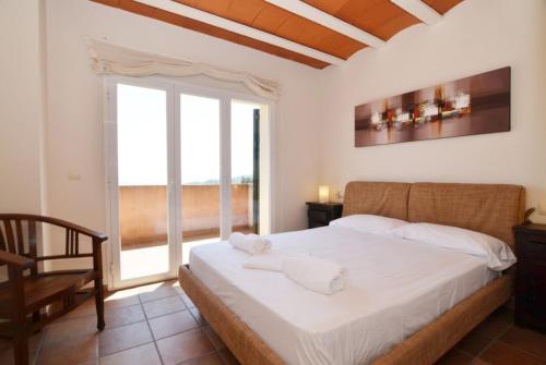 Postel nebo postele na pokoji v ubytování Club Villamar - Cala Llevado 40