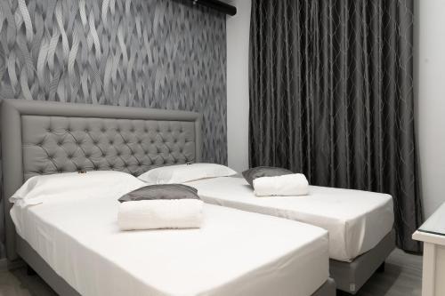 Tempat tidur dalam kamar di PRESTIGE casa vacanze