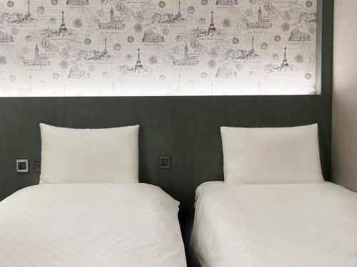 Кровать или кровати в номере 綺樂文旅 開封館 Le Room Hotel Kaifeng