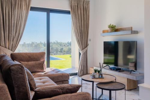 Televisyen dan/atau pusat hiburan di Villa Olivum by PosarelliVillas