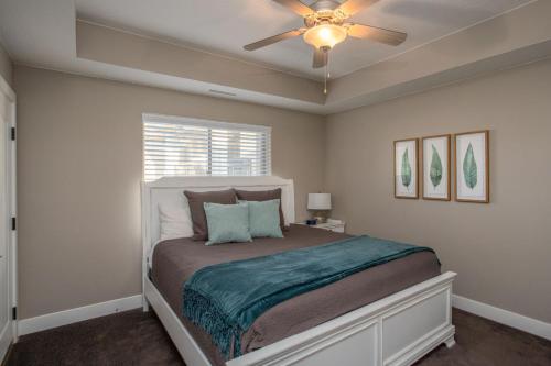 a bedroom with a bed with a ceiling fan at W307 Third Floor 3-bedroom Pool View in St. George