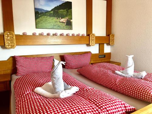 two beds with stuffed animals sitting on top of them at BERGFEX Gaisalphorn mit Sommer-Bergbahnticket in Oberstdorf