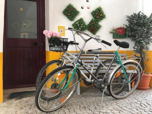 two bikes parked in front of a building at Évora City Break Apartment with Patio in the Historic Centre in Évora
