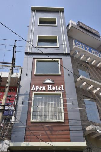 a apartment building with aap hotel written on it at Apex Hotel in Amritsar