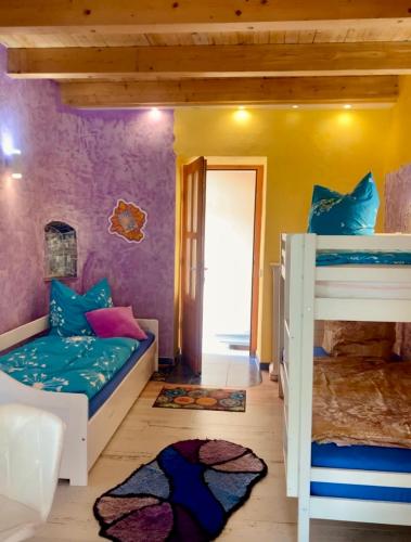 Postel nebo postele na pokoji v ubytování Boutique Hotel Shambala Zeitlos