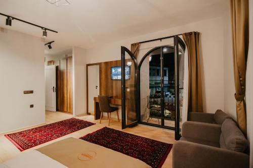 a living room with a couch and a mirror at Copper House in Trabzon